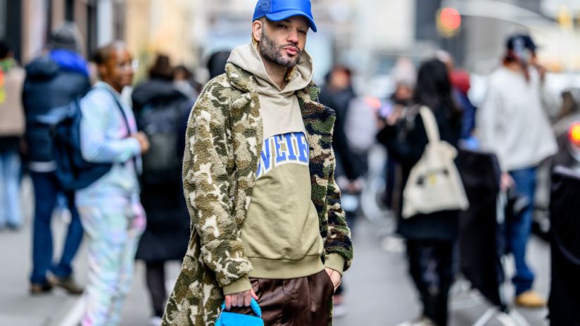 Jason C Peters wears a Coach bag and a fashion Noava sweater outside the Pamella Roland Show at Starrett-Lehigh Building during New York Fashion Week on February 12, 2024 in New York City. (Photo by Roy Rochlin/Getty Images)