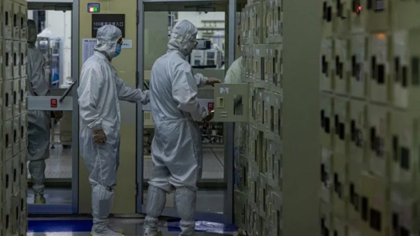 ASML designs and builds the systems and software used in the production of microchips, which are essential for data centres. (Photo by Annabelle Chih/Getty Images)