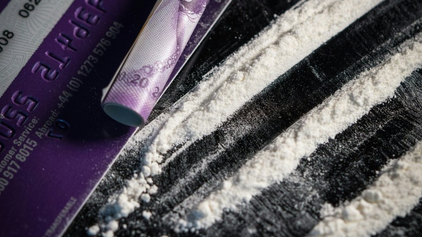 A line of cocaine with a British bank note (don't worry, it's actually baking powder) (Photo by Colin Davis on Unsplash)