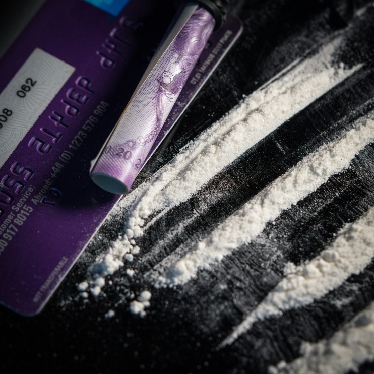 A line of cocaine with a British bank note (don't worry, it's actually baking powder) (Photo by Colin Davis on Unsplash)