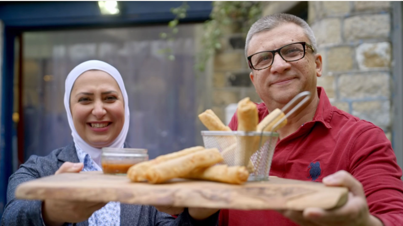 Razan Alsous and her husband Raghid Sandouk of Yorkshire Dama Cheese holding their famous 'Hello-Mi' rolls.