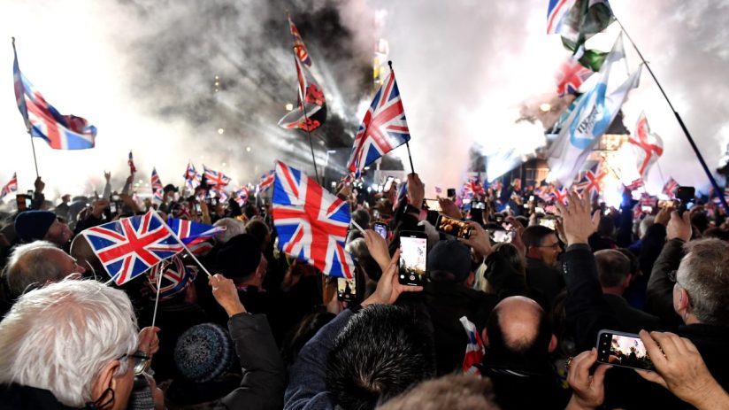 LONDON, ENGLAND - JANUARY 31: Pro Brexit supporters celebrates as the United Kingdom exits the EU during the Brexit Day Celebration Party hosted by Leave Means Leave at Parliament Square on January 31, 2020 in London, England. At 11.00pm on Friday 31st January the UK and Northern Ireland exits the European Union, 188 weeks after the referendum on June 23rd, 2016. (Photo by Jeff J Mitchell/Getty Images)