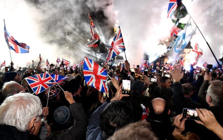 LONDON, ENGLAND - JANUARY 31: Pro Brexit supporters celebrates as the United Kingdom exits the EU during the Brexit Day Celebration Party hosted by Leave Means Leave at Parliament Square on January 31, 2020 in London, England. At 11.00pm on Friday 31st January the UK and Northern Ireland exits the European Union, 188 weeks after the referendum on June 23rd, 2016. (Photo by Jeff J Mitchell/Getty Images)