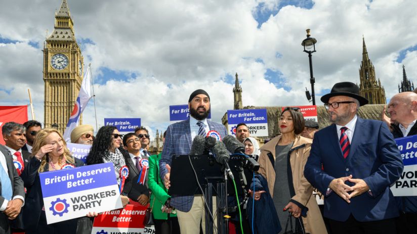 Leader of the Workers Party of Britain George Galloway (R) looks on as former England cricketer Monty Panesar (C) addresses fellow party candidates in Parliament Square on April 30, 2024 in London, England. (Photo by Leon Neal/Getty Images)