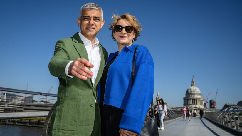 LONDON, ENGLAND - MAY 7: London Mayor Sadiq Khan and his wife Saadiya Khan pose for photos as they walk across the Millennium Bridge ahead of his swearing in for a third term on May 7, 2024 in London, England. (Photo by Leon Neal/Getty Images)