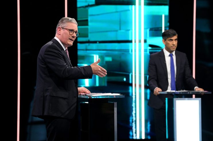 SALFORD, ENGLAND - JUNE 4: (EDITOR'S NOTE: This Handout image was provided by a third-party organization and may not adhere to Getty Images' editorial policy.) In this handout provided by ITV, Labour Party leader Keir Starmer (L) and Prime Minister Rishi Sunak speak on stage during the first head-to-head debate of the General Election on June 4, 2024 in Salford, England. The first televised debate of the 2024 General Election between Rishi Sunak and Sir Keir Starmer will take place on ITV. (Photo by Jonathan Hordle - ITV via Getty Images)
