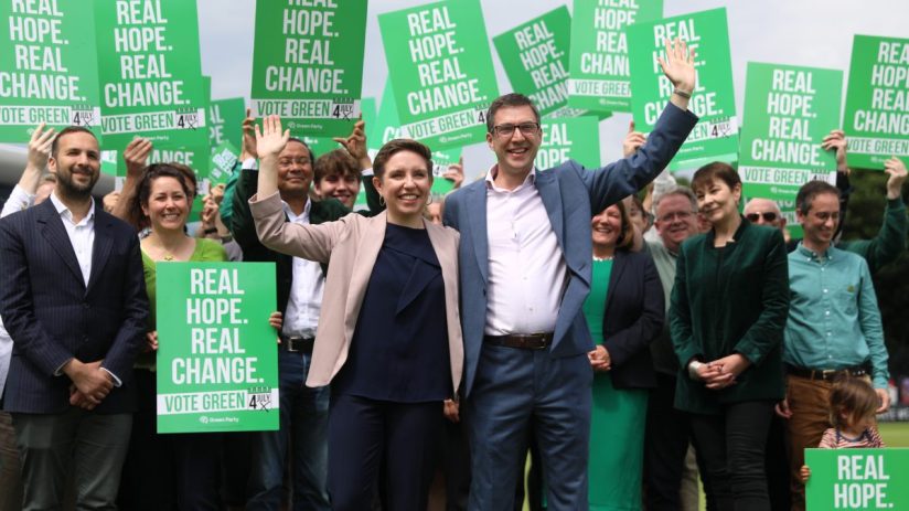 BRIGHTON, ENGLAND - JUNE 12: Co-leaders of the Green Party Carla Denyer (Centre L) and Adrian Ramsay (Centre R) pose with supporters after The Green Party Manifesto launch on June 12, 2024 in Brighton, England. The Green Party Manifesto is launched today by co-leaders, Carla Denyer, the Green Party candidate for Bristol Central, and Adrian Ramsay, the Green Party candidate for Waveney Valley. Also attending is the Green Party member Sian Berry, candidate for Brighton Pavilion campaigning for the 4th July general election.(Photo by Alishia Abodunde/Getty Images)