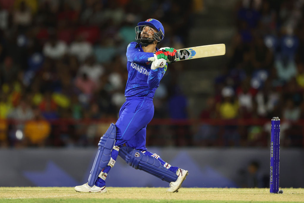 Rashid Khan hit three late sixes as Afghanistan reached the T20 World Cup semi-finals