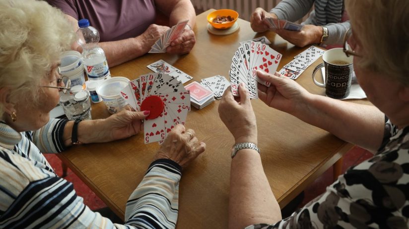 BERLIN, GERMANY - SEPTEMBER 20: Elderly women play a cards game of rummy at the Mireille Mathieu senior citizens' center on September 20, 2017 in Berlin, Germany. According to government staistics the overall population of approximately 82.3 million in Germany is predicted to decline over coming decades, while the country's population of those aged 67 and older is predicted to rise from 15.1 million in 2013 to 21.5 million by 2040, or 42%. This trend creates huge challenges for policymakers, who must adapt Germany's employment, welfare, senior care, health and pension systems to cope. The Mireille Mathieu center is one of many community centers across Berlin that offer programs, including physical exercise, language courses, computer classes and other activities for the elderly. (Photo by Sean Gallup/Getty Images)
