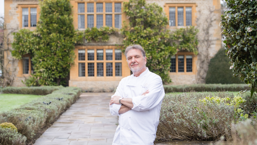 Raymond Blanc outside his restaurant with rooms, Le Manoir