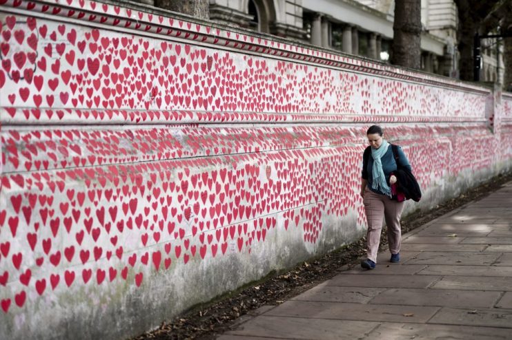 A member of the public observing the National Covid Memorial Wall, Photo credit: Jordan Pettitt/PA Wire