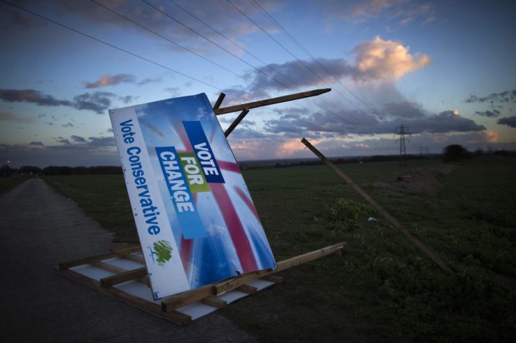 RAMSGATE, UNITED KINGDOM - MARCH 31: A Conservative election billboard is blown over in high winds in a field on March 31, 2015 near Ramsgate, United Kingdom. (Photo by Dan Kitwood/Getty Images)