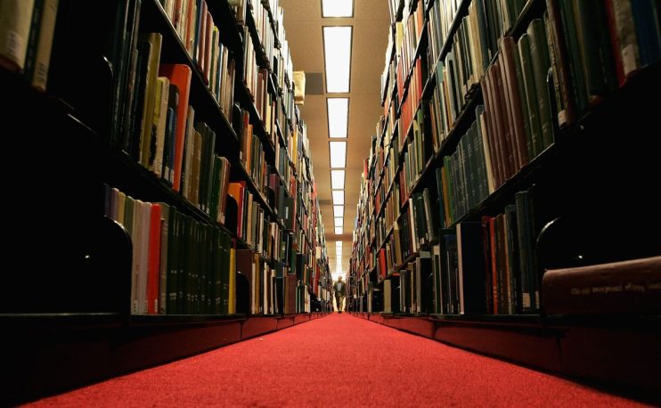 STANFORD, CA - DECEMBER 17: A man browses through books at the Cecil H. Green on the Stanford University Campus December 17, 2004 in Stanford, California. Google, the internet search engine, has announced a long-term project to put 15 million books from seven of the world's most prestigious libraries online and make them searchable. Included will be the libraries of Harvard, Stanford, the University of Michigan, the New York Public Library and the University of Oxford, including the Bodleian. Books and periodicals will be scanned and project is expected to take six years and cost more than $100 million. (Photo by Justin Sullivan/Getty Images)