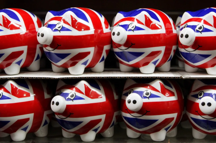 LONDON - JANUARY 23: Piggy banks painted with the Union Flag go on sale in a shop on Oxford Street.(Photo by Oli Scarff/Getty Images)