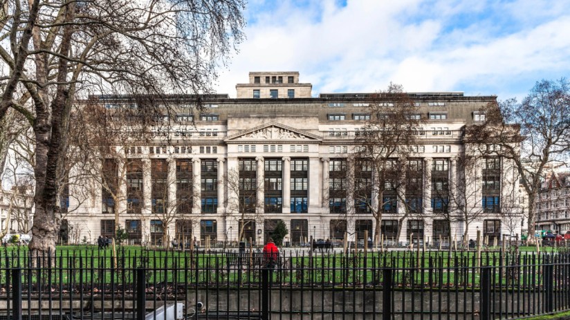 A building with a roman facade photographed from across a square