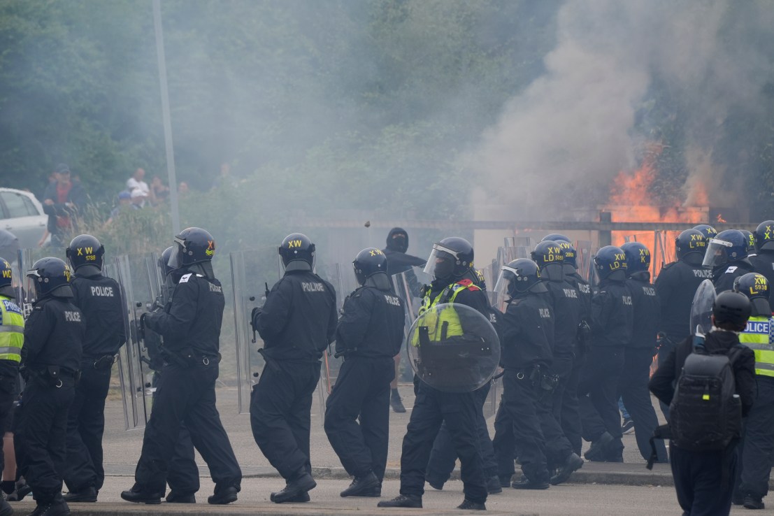 Police officers during an anti-immigration demonstration outside the Holiday Inn Express in Rotherham, South Yorkshire. Picture date: Sunday August 4, 2024. PA Photo. See PA story POLICE Southport. Photo credit should read: Danny Lawson/PA Wire