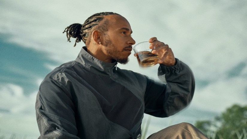 Lewis Hamilton drinking his non-alcoholic tequila alternative and blue agave spirit, Almave, which spirits giant Pernod Ricard has bought a stake in.
