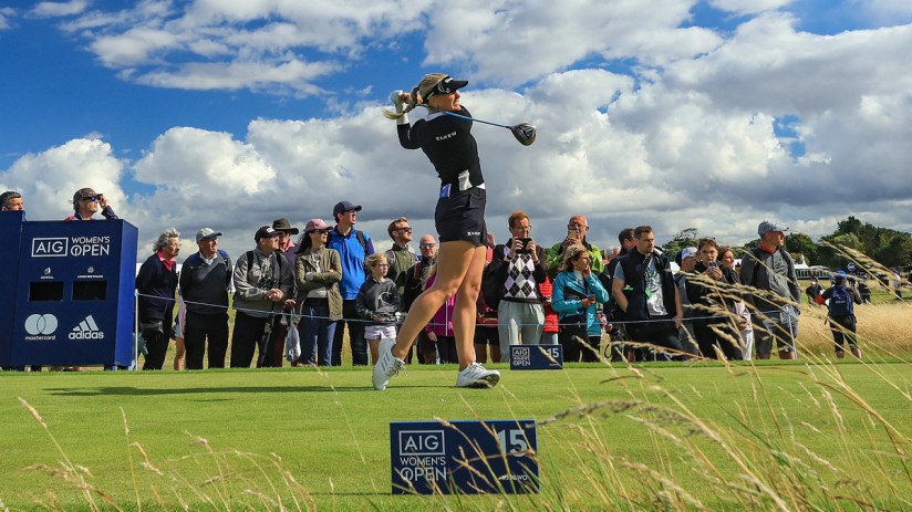 A golf player tees off on the 15th hole at the Women's British Open