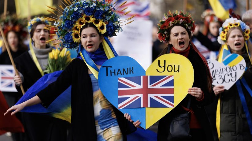 LONDON, ENGLAND - FEBRUARY 24: People with placards and Ukrainian flags participate in a march to mark 2 years since the beginning of the Russian invasion of Ukraine on February 24, 2024 in London, United Kingdom. (Photo by Dan Kitwood/Getty Images)