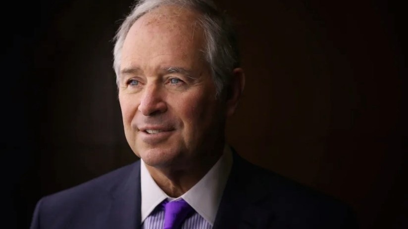 Headshot of Stephen Schwarzman, co-founder of Blackstone, in a navy suit and purple tie and