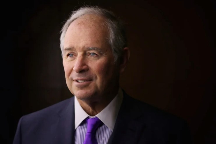 Headshot of Stephen Schwarzman, co-founder of Blackstone, in a navy suit and purple tie and
