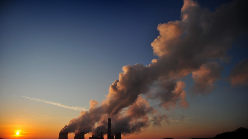 The sun setting over Ratcliffe-on-Soar Power Station near Nottingham. The UK's last remaining coal-fired power station is to shut at the end of September, drawing to a close Britain's 142-year reliance on the fossil fuel to produce electricity. Photo Credit: Matthew Vincent/PA Wire
