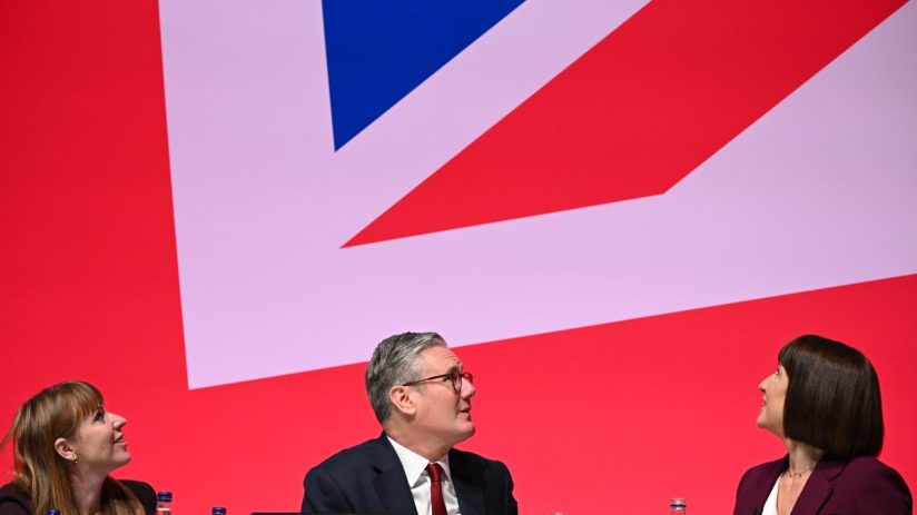 LIVERPOOL, ENGLAND - SEPTEMBER 23: (L-R) Deputy Prime Minister Angela Rayner, Prime Minister Keir Starmer and Chancellor of the Exchequer, Rachel Reeves seen on stage during the Labour Party Conference 2024 at ACC Liverpool on September 23, 2024 in Liverpool, England. This is Labour's first conference since they were returned as the governing party of The UK and Northern Ireland by voters in the July election, ending 14 years of Conservative rule. They won with a landslide majority of 172 seats, and 412 in total. (Photo by Leon Neal/Getty Images)