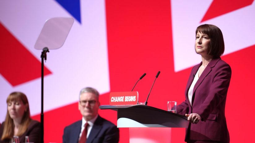 LIVERPOOL, ENGLAND - SEPTEMBER 23: Deputy Prime Minister Angela Rayner, Prime Minister Keir Starmer look on as Chancellor of the Exchequer, Rachel Reeves delivers her keynote speech during the Labour Party Conference 2024 at ACC Liverpool on September 23, 2024 in Liverpool, England. This is Labour's first conference since they were returned as the governing party of The UK and Northern Ireland by voters in the July election, ending 14 years of Conservative rule. They won with a landslide majority of 172 seats, and 412 in total. (Footage by Christopher Furlong/Getty Images)