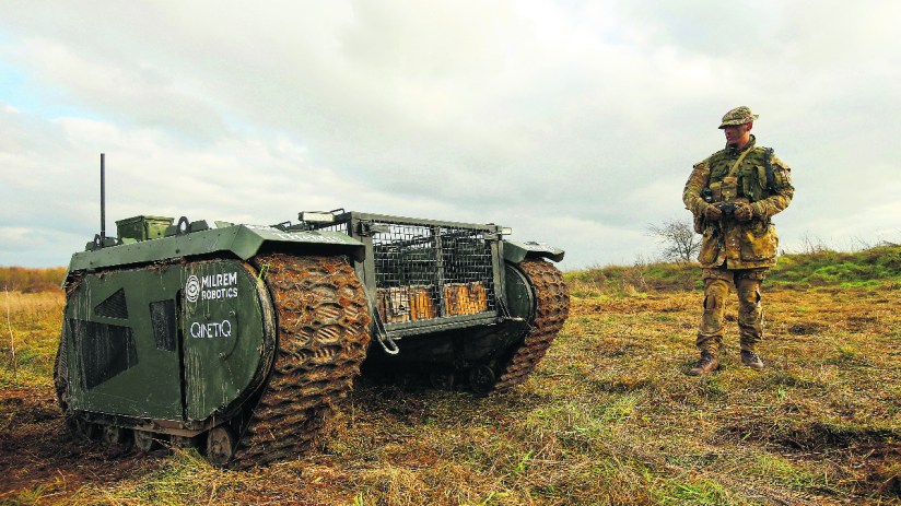 (Owen Stringer, a rifleman in the British Army, operates a Tracked Hybrid Modular Infantry System, THeMIS, developed by Milrem Robotics and QinetiQ Group Plc,. Photographer: Luke MacGregor/Bloomberg via Getty Images)