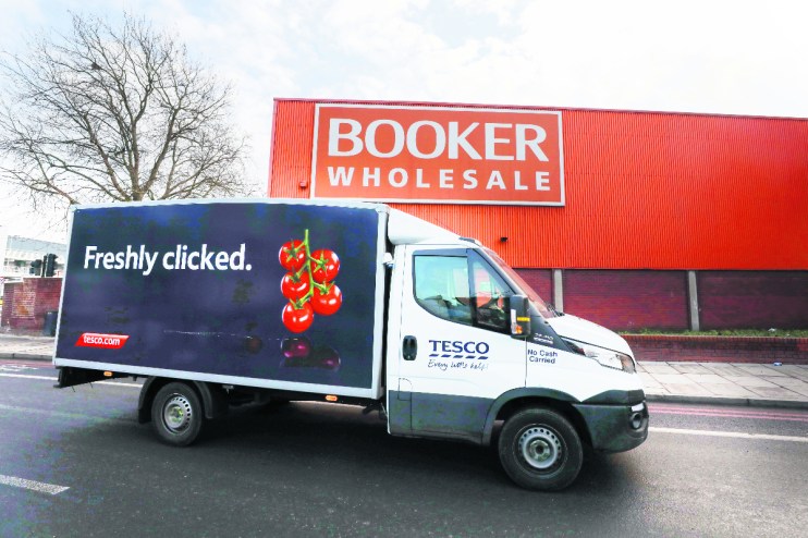 Retail giant Tesco has hiked its profit outlook for the year