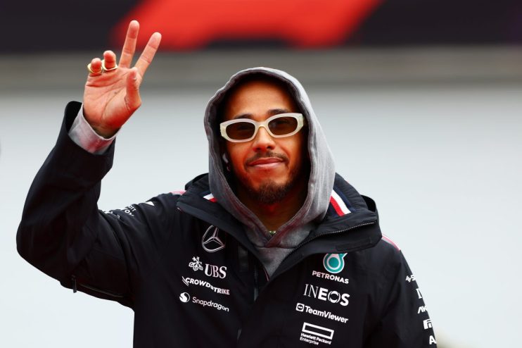 Multiple F1 champion Lewis Hamilton indicating his preference for the two-finger KitKat. Possibly