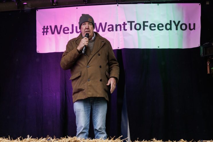 LONDON, ENGLAND - NOVEMBER 19: TV presenter Jeremy Clarkson speaks to the crowd during a farmers demonstration on Whitehall on November 19, 2024 in London, England. Thousands of farmers descended on central London to protest against changes to inheritance tax announced in the budget last month. The farmers argue that the changes will destroy family farms and that the nation's food security is at risk, while the government says that the change will likely affect only around 500 larger estate farms. (Photo by Dan Kitwood/Getty Images)