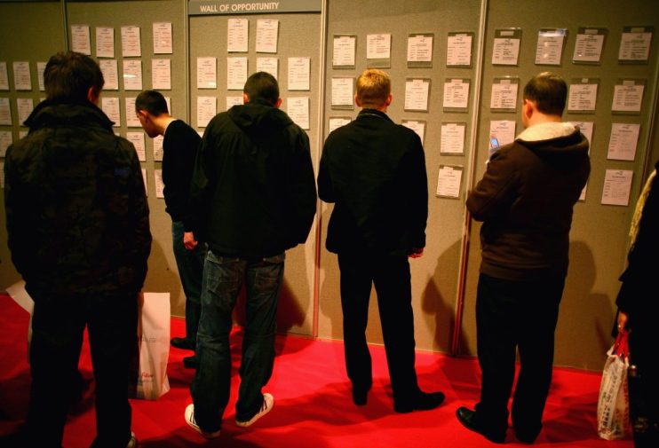GLASGOW, SCOTLAND - FEBRUARY 13: Jobseekers look at live jobs advertised at Scotland's Careers and Jobs Fair at the SECC on February 13, 2009 in Glasgow, Scotland. The jobs and careers event, expected to attract more than 20,000 visitors, is open to unemployed job seekers, people changing jobs or facing particular barriers to employment or redundancy. (Photo by Jeff J Mitchell/Getty Images)