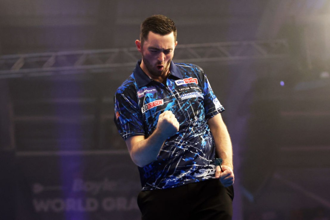 Luke Humphries of England celebrates victory over Ryan Joyce of England during the Semi-Final match on day six of the 2024 BoyleSports World Grand Prix darts at Mattioli Arena on October 12, 2024, in Leicester, England. (Photo by Cameron Smith/Getty Images)