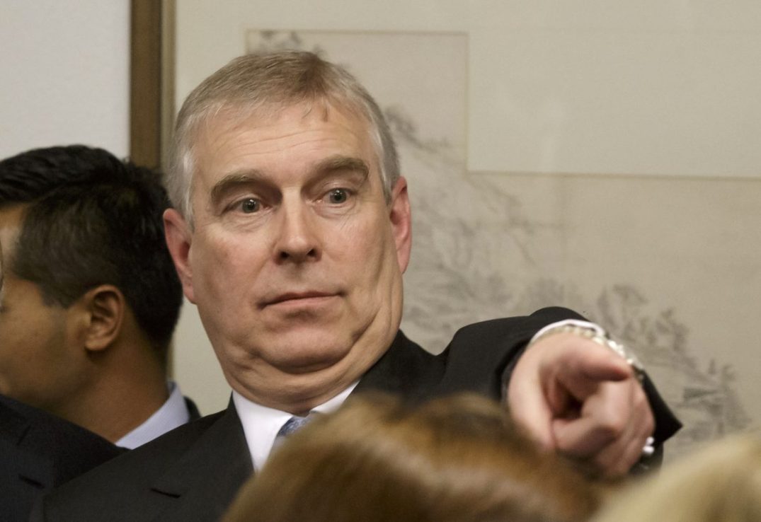 DAVOS, SWITZERLAND - JANUARY 22: Prince Andrew, Duke of York points his finger as he speaks to business leaders during a reception at the sideline of the World Economic Forum on January 22, 2015 in Davos Switzerland.  Prince Andrew has publicly denied allegations he had sex with an underage teenager. He made the denial during a visit to the World Economic Forum in Davos, Switzerland, on Thursday. It was his first public appearance since the charges. (Photo by Michel Euler-WPA Pool/Getty Imaes)