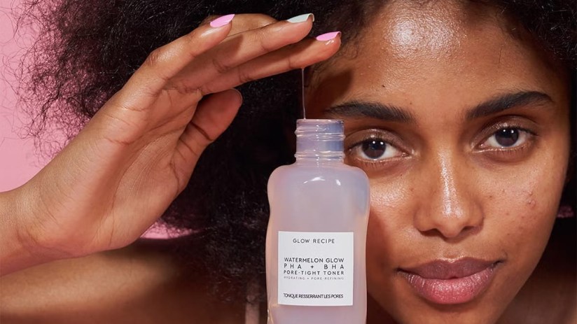 Cleansers from Cult Beauty - Model holding a Cleanser for your skin
