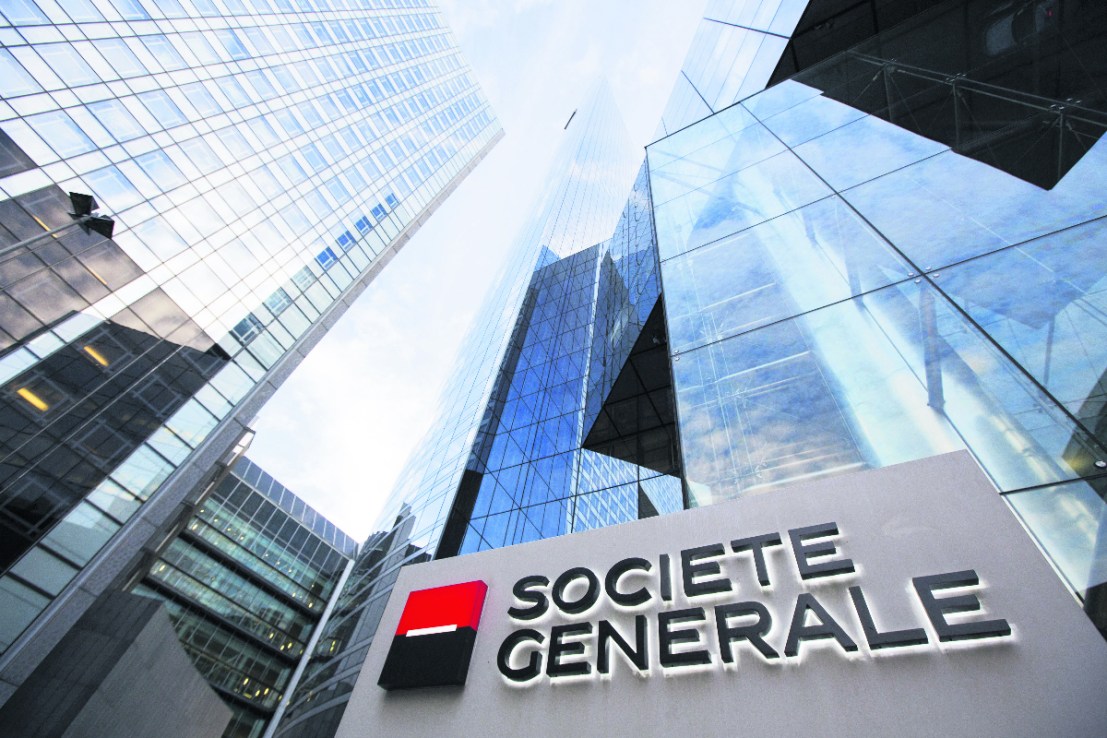 The Societe Generale SA logo sits on a sign outside the bank's headquarters in La Defense business district in Paris, France (Photographer: Jason Alden/Bloomberg via Getty Images)