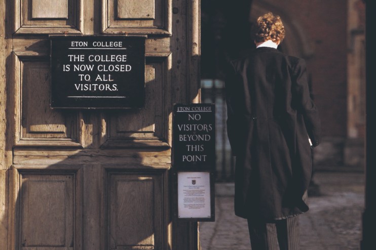 Pupil at Eton College hurries between lessons (Photo by Graeme Robertson/Getty Images).