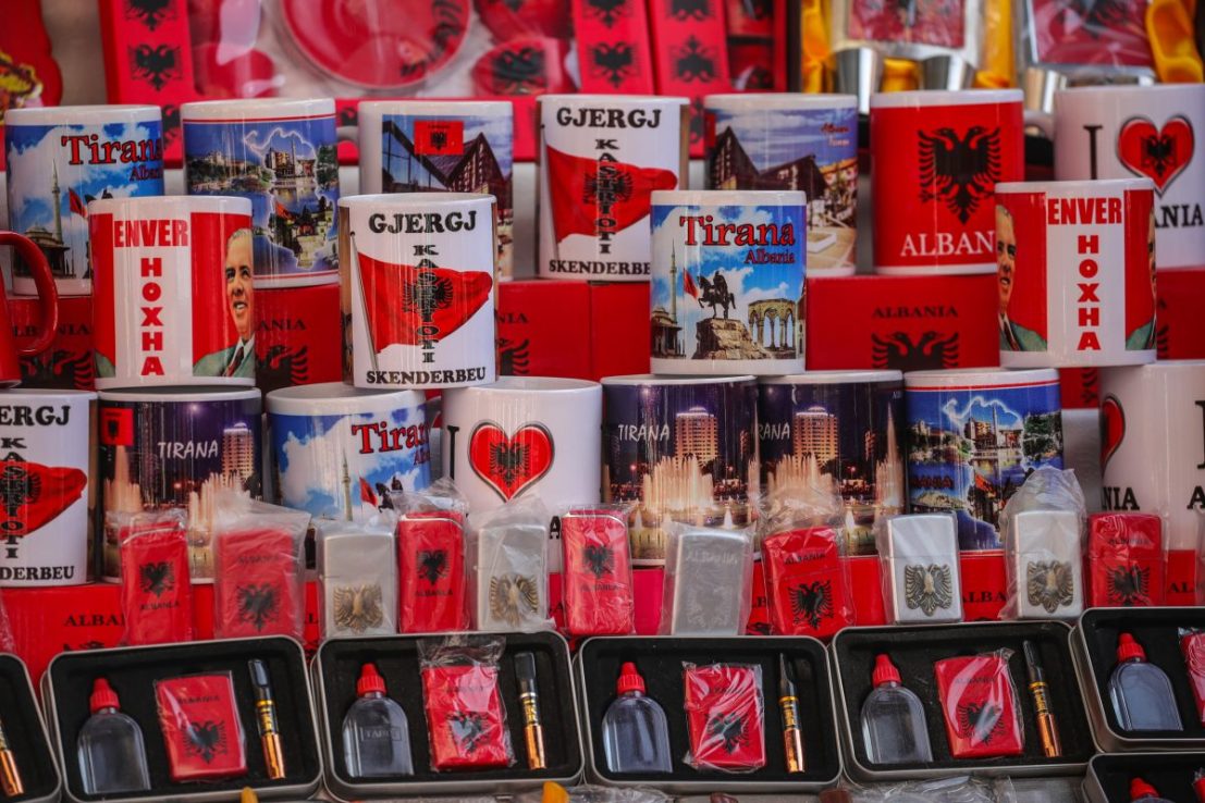 TIRANA, ALBANIA - NOVEMBER 04: Souvenirs are displayed for sale including mugs with the face of former Albanian dictator Enver Hoxha as tourist attractions in a open market on November 4, 2022 in Tirana, Albania. The United Kingdom recently reported a considerable uptick in the number of Albanians crossing the Channel illegally to enter the UK with the Albanian government pushing back and blaming UK policy failures. (Photo by Armando Babani/Getty Images)