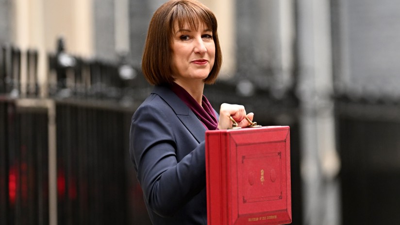 LONDON, ENGLAND - OCTOBER 30: Chancellor of the Exchequer, Rachel Reeves, poses with the red Budget Box as she leaves 11 Downing Street to present the government's annual budget to Parliament on October 30, 2024 in London, England. This is the first Budget presented by the new Labour government and Chancellor of the Exchequer, Rachel Reeves. (Photo by Leon Neal/Getty Images)