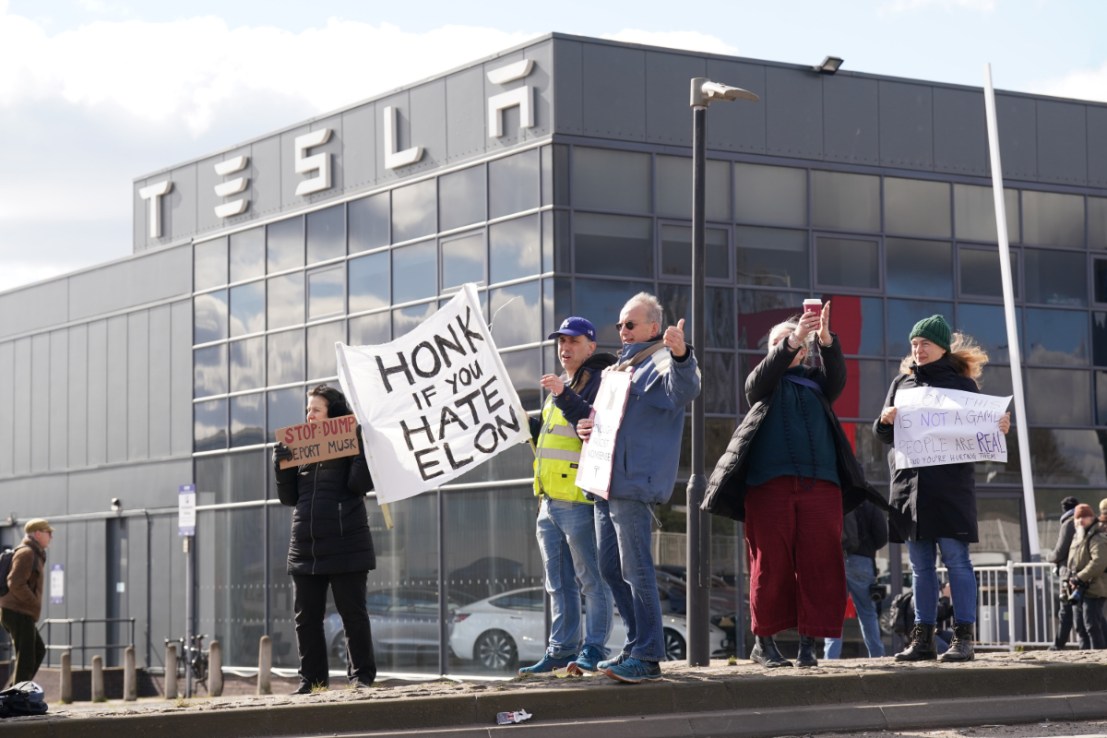 Protesters gathered outside a Tesla dealership in London have called for people to boycott the Elon Musk owned electric car maker. Photo: PA