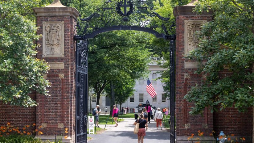 CAMBRIDGE, MASSACHUSETTS - JUNE 29: People walk through the gate on Harvard Yard at the Harvard University campus on June 29, 2023 in Cambridge, Massachusetts. The U.S. Supreme Court ruled that race-conscious admission policies used by Harvard and the University of North Carolina violate the Constitution, bringing an end to affirmative action in higher education. (Photo by Scott Eisen/Getty Images)