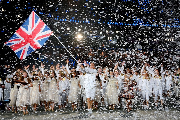 LONDON, ENGLAND - JULY 27: Sir Chris Hoy of the Great Britain Olympic cycling team carries his country's flag as he leads Great Britain into the stadium during the Opening Ceremony of the London 2012 Olympic Games at the Olympic Stadium on July 27, 2012 in London, England. (Photo by Cameron Spencer/Getty Images)