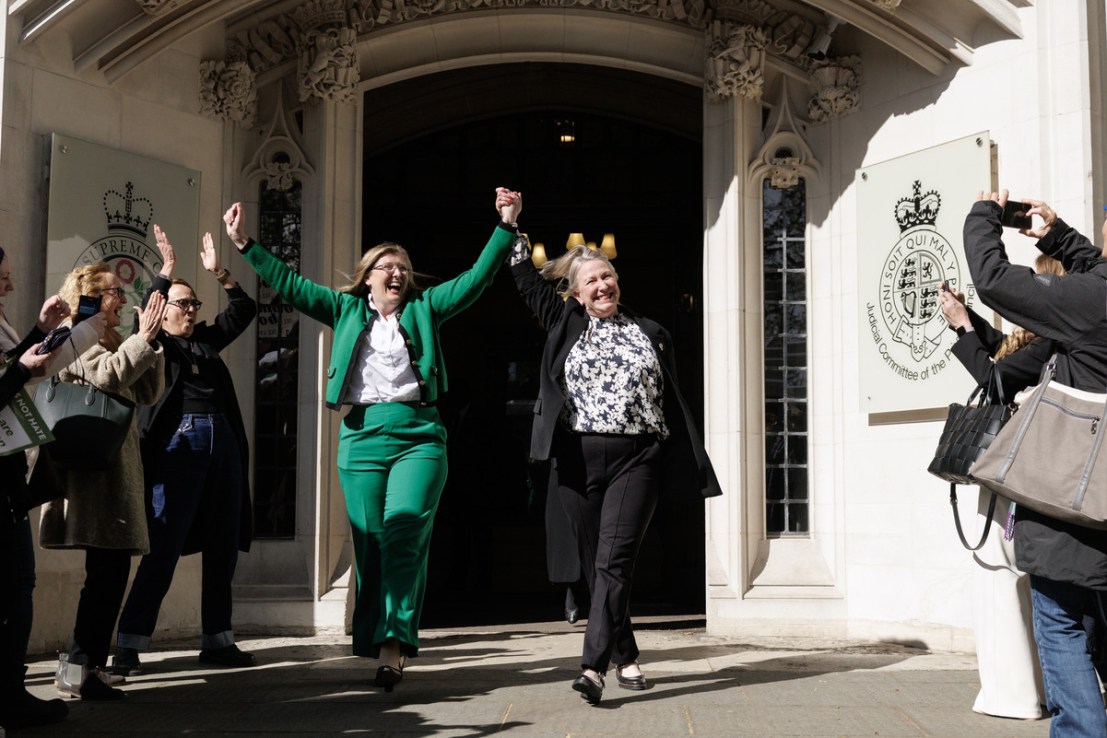 Susan Smith (L) and Marion Calder, directors of 'For Women Scotland' cheer as they leave the Supreme Court after it ruled that unanimously that "the terms 'woman' and 'sex' in the Equality Act 2010 refer to a biological woman and biological sex (Photo by Dan Kitwood/Getty Images)