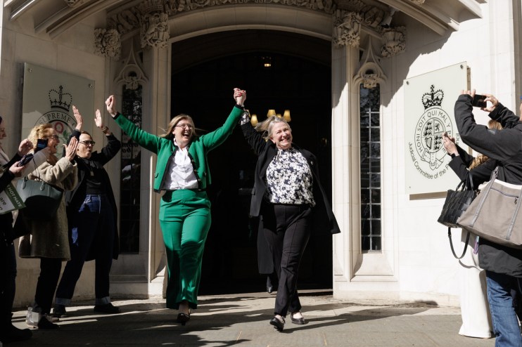 Susan Smith (L) and Marion Calder, directors of 'For Women Scotland' cheer as they leave the Supreme Court after it ruled that unanimously that "the terms 'woman' and 'sex' in the Equality Act 2010 refer to a biological woman and biological sex (Photo by Dan Kitwood/Getty Images)