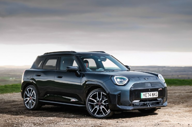 Electric Mini Aceman SUV showcasing its unique design and character in a dynamic urban setting