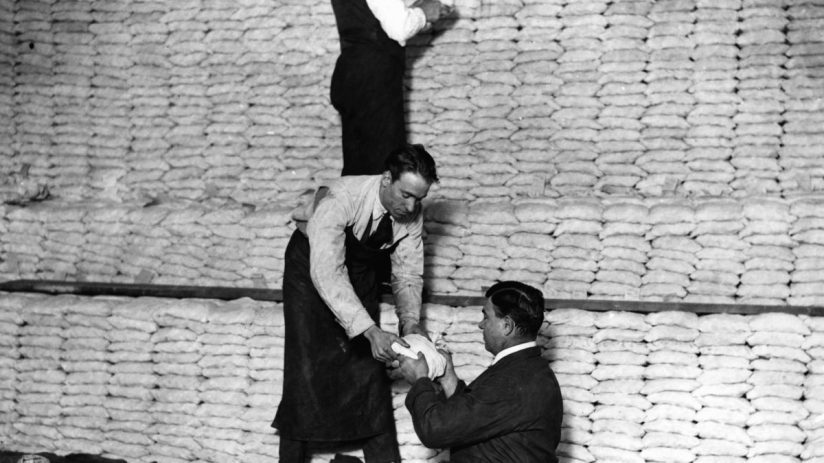 circa 1923: Men stacking silver at the Royal Mint. (Photo by Hulton Archive/Getty Images)