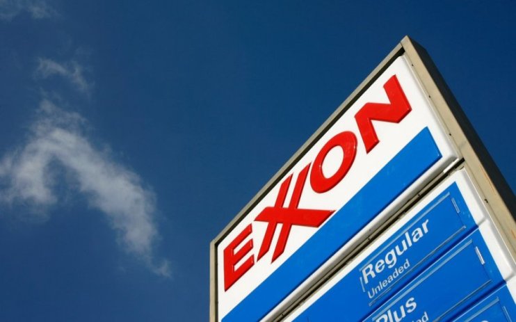 Exxon Mobil profits halve in the third quarter